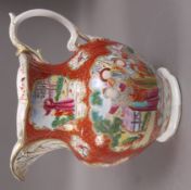 A 19th century china jug painted in chinoiserie manner with panels of figures against an iron red