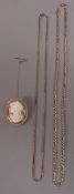 Two neckchains both in 9ct gold of hollow figaro and fox tail links together with a shell cameo
