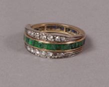 A sapphire, emerald and diamond cocktail ring c.1940 in 14ct rose gold, the channel set calibre