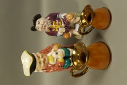 Two Toby jugs and two pottery jugs of graduated size
