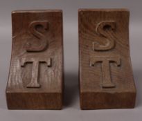 A pair of Thompson of Kilburn mouseman bookends, carved in relief with the initials S T and with a