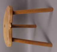 A Thompson of Kilburn, Mouseman oak three legged stool, carved in relief with a mouse