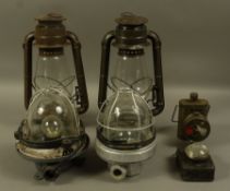 Two hurricane lamps, two bulk head lamps and two bicycle lamps, all reproductions