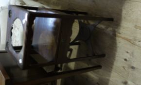 A 19th century mahogany washstand of square outline having bowl aperture above an undertier with