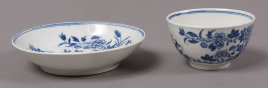 An early Worcester blue and white tea bowl and saucer, printed with zigzag fence pattern