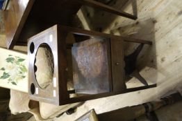 A 19th century mahogany washstand of square outline having apertures to the surface above an