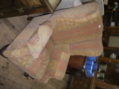 A matched pair of Georgian style winged armchairs on leaf carved cabriole legs with claw and ball