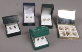 Thirteen pairs of stud earrings all in 9ct gold, variously set with small diamonds, pearls, jade,