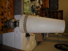A 1970s brown and white glazed pottery floor lamp with original hessian style conical shade