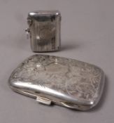 A George V silver vesta case with engine turned decoration and open cartouche by Colea Hewer Chester