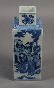 An 18th/19th century Chinese blue and white vase of square section, painted to each alternate side