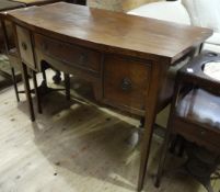 A early 20th century mahogany bow fronted sideboard of Georgian design having a drawer above a