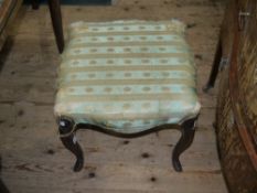 A Victorian mahogany dressing stool of square serpentine outline on moulded cabriole legs