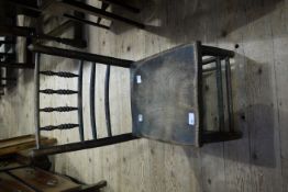A child's elm chair with spindle and rail back