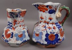 Two Mason Ironstone octagonal jugs of graduated size under glazed in iron red with serpent