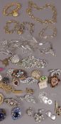 A box of costume jewellery including chains, necklaces, brooches etc