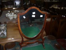 An Edwardian mahogany shield shaped toilet mirror