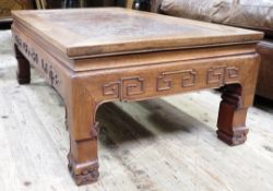 A Chinese hardwood coffee table the surface having an indented burr wood panel which swivels to