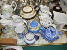 Various tea pots and jugs, and a leather covered Omega watch case and a box set of four mother of
