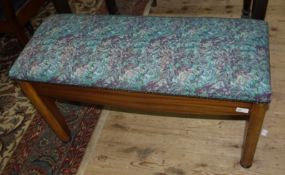 A 1950s Sapele mahogany duet stool with upholstered top and a quantity of sheet music
