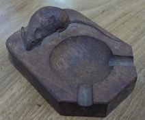 An oak ashtray carved in relief with a mouse