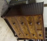 A Victorian mahogany chest of two short and three long grated cockbeaded drawers with turned handles
