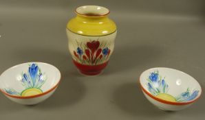 A Moorland hand painted vase in the style of Clarice Cliff painted with crocus, together with two