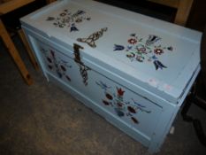 A Hungarian lodging box painted with stylised flowers and birds on a pale blue ground
