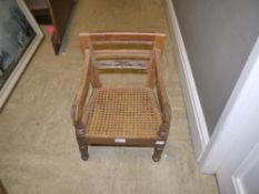 A child's chair with bergere caned seat
