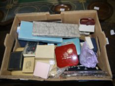 Box of costume jewellery including brooches, necklaces, beads, travel clock etc