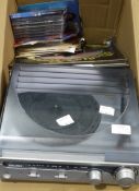 A Bush turntable radio system together with a quantity of LPs including classical and 80's pop and