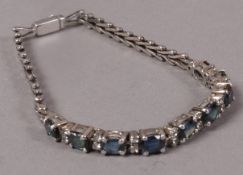 A sapphire and colourless spinel bracelet in silver, the oval faceted and small circular faceted