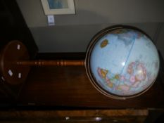 A globe on wooden stand