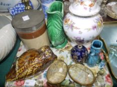 A continental floral decorated vase and cover, two Dartmouth fish vases, a blue glass cologne bottle