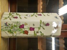 A reproduction hexagonal umbrella tile, printed in coloured enamels with roses and butterflies