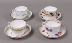 Three Newhall tea cups and saucers, various patterns and a tea cup and associated saucer