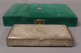 An Iranian silver cigar box, of damescened decoration and applied yellow metal crest; inscription