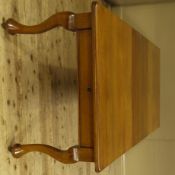 A early 20th century mahogany wind out action dining table with two additional leaves, thumb moulded