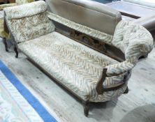 An early 20th century mahogany chaise upholstered in orange and green zig zag fabric on cabriole