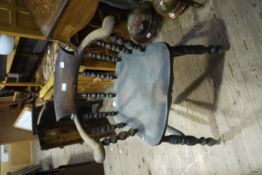 A 19th century elm smokers bow on turned framing