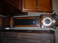 A late 20th century oak and glazed grandmother clock having an arched wood, tempus fugit to the