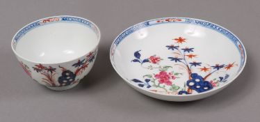 A Lowestoft 'redgrave' pattern tea bowl and saucer