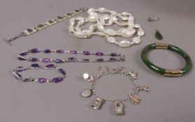 A small collection of jewellery including nephrite stiff hinged bangle and pendant both with gilt