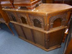 AN 'OLD CHARM' CARVED OAK DRINKS BAR (sd)