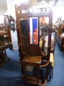 AN EDWARDIAN WALNUT MIRROR BACK HALL STAND (sd)