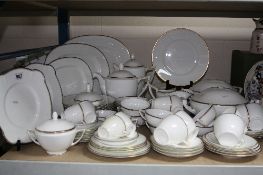 A COMPREHENSIVE BONE CHINA WHITE AND GILT RIMMED DINNER SERVICE, unmarked, (over 70 pieces) (s.d.)