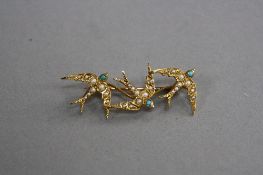 A VICTORIAN 15CT SEED PEARL SWALLOW BROOCH