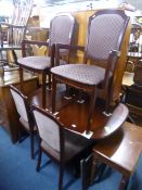 A MAHOGANY DINING SUITE, comprising extending table, six chairs including two carvers and a wall