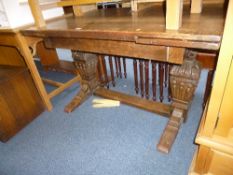 A CARVED OAK DRAW LEAF TABLE, approximate extended size width 162cm x depth 84cm x height 75cm (sd)