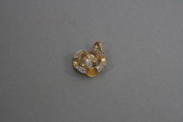AN 18CT DIAMOND SET PENDANT